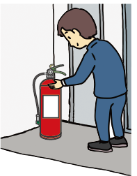 消火器の点検をする人